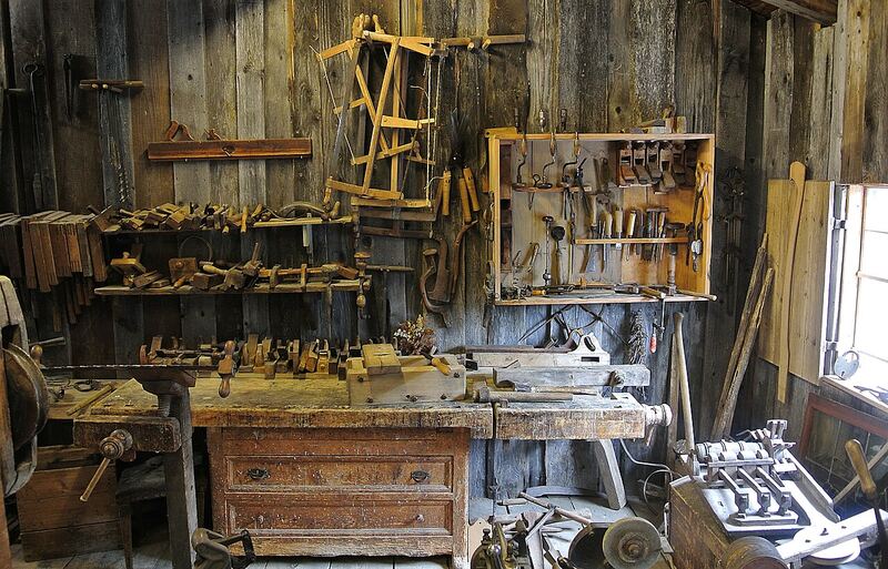 A woodworking shop workbench with tools used for building custom cabinets and furniture